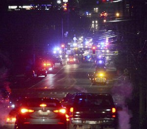 Law enforcement vehicles gather near Skagit Valley College in Mount Vernon, Wash., Thursday, Dec. 15, 2015.
