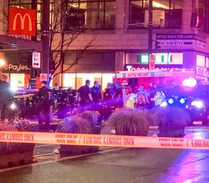 Police work the scene of a shooting on Third Avenue and Pine Street, Wednesday, Jan. 22, 2020, in Seattle.