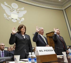 Secret Service Director Julia Pierson, left, is sworn in on Capitol Hill in Washington, Tuesday, Sept, 30, 2014, prior to testifying before the House Oversight Committee as it examines details surrounding a security breach at the White House when a man climbed over a fence, sprinted across the north lawn and dash deep into the executive mansion before finally being subdued.