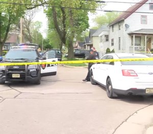 Thirteen people were shot while gathering in a vacant lot to remember a man who went missing for several days before being found dead earlier this month.