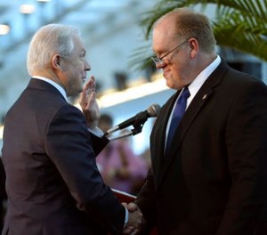 U.S. Attorney General Jeff Sessions, left, shakes hands with Tom Homan, acting Director of U.S. Immigration and Customs Enforcement, before speaking at a news conference, Wednesday, Aug. 16, 2017, at PortMiami in Miami.