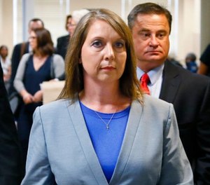 Betty Shelby leaves the courtroom with her husband, Dave Shelby, right, after the jury in her case began deliberations in Tulsa, Okla., Wednesday, May 17, 2017.