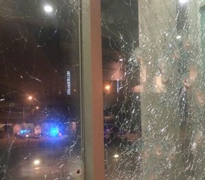 Photo tweeted by Dallas Police Department after shooting shows damage to windows.