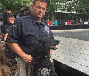 Ssiller the TSA dog with a TSA official.