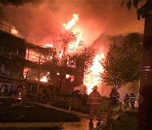 The four-story apartment complex started after an explosion.