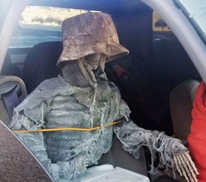 State troopers found a dummy skeleton strapped into the front passenger seat of a 62-year-old man cited for an HOV lane violation in Phoenix. (Photo/Arizona Department of Public Safety/AP)