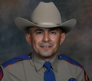 This undated photo provided by the Texas Department of Public Safety shows Services for Texas Department of Public Safety Trooper Moises Sanchez. (Texas Department of Public Safety via AP)