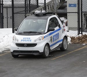 A New York City Police Department Smart car is parked in the parking lot of Central Park's precinct, Thursday, Feb. 12, 2015, in New York.