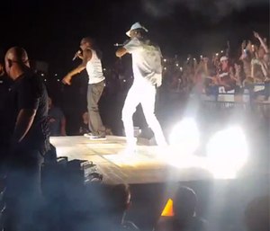 31 were taken to local hospitals with minor injuries; Snoop Dogg and Wiz Khalifa were escorted from the stage.
