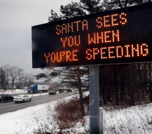 A Maine Department of Transportation sign uses holiday humor to warn drivers to watch their speed on Interstate 295, Thursday, Dec. 19, 2016, in Portland, Maine.