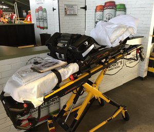 A cot or stretcher is the safest place in the ambulance for the patient.