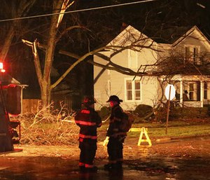 Firefighters work the site of a damaged area in Ottawa, Ill., after a tornado moved through the area Tuesday, Feb. 28, 2017. (Allen Cunningham/Chicago Sun-Times via AP)