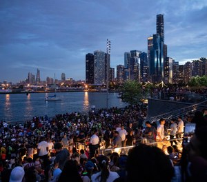 In this Thursday, July 4, 2019 photo, thousands of people gather at Chicago's Navy Pier to celebrate and watch the 4th of July fireworks. (AP Photo/Amr Alfiky)
