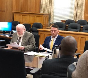 A Pulaski County judge on Tuesday found the city in contempt of his order to reinstate Officer Charles Starks (left), who had been fired last year after a fatal OIS. (Photo/AP