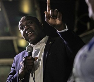 Lewis Reed, president of the Board of Aldermen, delivers a brief speech at a Democratic presidential primary election watch party at McGurk's Irish Pub and Garden, Tuesday, March 10, 2020, in St. Louis. (Lexi Browning/St. Louis Post-Dispatch via AP)