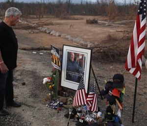 Gary Parmely, father of Jeremy Stoke of the Redding Fire Department, visits a memorial for his son who was killed in the Carr Fire.