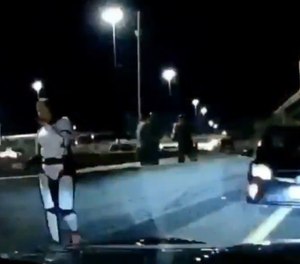 Trooper Britta Foesch, still in her Stormtrooper costume, stops a suspected drunk driver on her way home from a Halloween party.