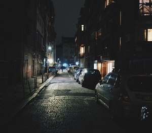The location was a poorly lit business district at night, which typically has lots of people hanging out.