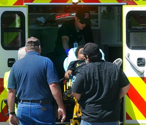 An injured student is put into an ambulance. (Guiseppe Barranco/The Beaumont Enterprise via AP)