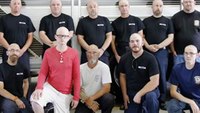 Firefighters shave heads to support teen colleague
