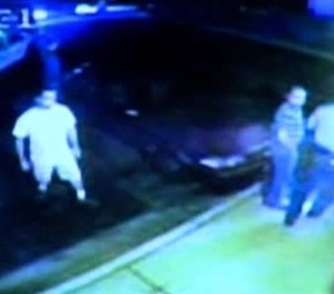 This still image taken from a surveillance video shows a moment leading up to the Marie's Pizza shooting. (Image/Rockford PD)