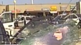 Video: Suspect shoots through windshield at cops during pursuit