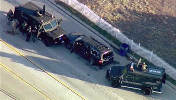 In this image taken from video, armored vehicles surround Farook's SUV following the shootout.
