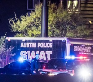 The scene outside a Round Rock-area hotel where authorities say the suspect in a string of Austin bombings has died on March 21, 2018.