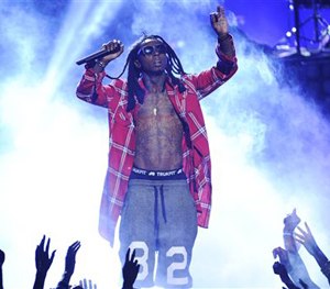 In this June 29, 2014 file photo, Lil' Wayne performs at the BET Awards at the Nokia Theatre in Los Angeles.