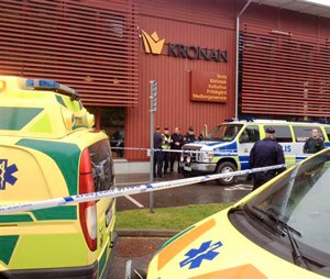 Emergency services attend the scene after a masked man attacked people with a sword. (Stig Hedstrom / TT via AP)
