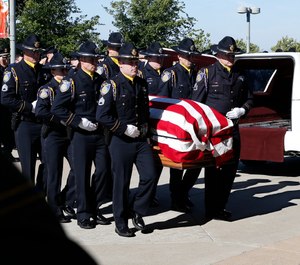 The flag draped casket of Sacramento Police Officer Tara O'Sullivan is carried into the Bayside Adventure Church for memorial services in Roseville, Calif., Thursday, June 27, 2019. (AP Photo/Rich Pedroncelli)