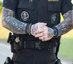 Chicago police union to fight order banning visible tattoos, baseball caps