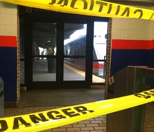 Police tape blocks off a train track at the 69th Street Terminal in Upper Darby, Pa. (AP Photo/Anthony Izaguirre)