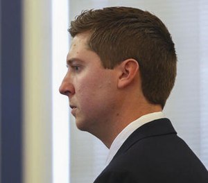 Ray Tensing reviews his body camera video of a stop previous to the Sam DuBose stop on the fifth day of his trial, Tuesday, Nov. 8, 2016, in Cincinnati. (Cara Owsley/The Cincinnati Enquirer via AP, Pool)