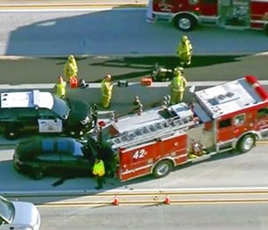 A still frame from video provided by KCBS-TV shows a Tesla Model S electric car that has crashed into a fire engine on Interstate 405 in Culver City, Calif. (KCBS-TV via AP)