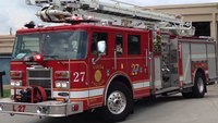 Fire dept. removes blue stripe stickers from fire trucks