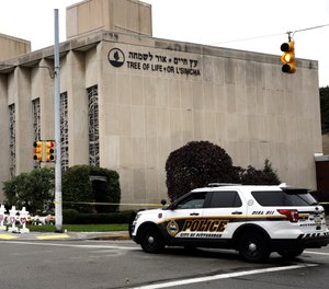 A police vehicle is posted near the Tree of Life/Or L'Simcha Synagogue in Pittsburgh, Monday, Oct. 29, 2018. Tree of Life shooting suspect Robert Gregory Bowers is expected to appear in federal court Monday. Authorities say he expressed hatred toward Jews during the rampage Saturday morning and in later comments to police. (AP Photo/Matt Rourke)