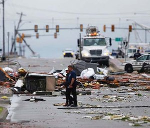 A possible tornado struck near midtown Tulsa and causing power outages and roof damage to businesses. (Tom Gilbert/Tulsa World via AP)