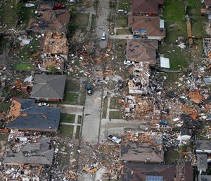 Destroyed and damaged homes are seen in this aerial photo after a tornado tore through the eastern neighborhood in New Orleans. (AP Photo/Gerald Herbert)