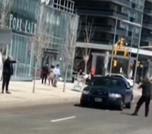 Minassian got out of the van and confronted police by pointing a black object in his hand as if it were a gun. (Photo/YouTube)