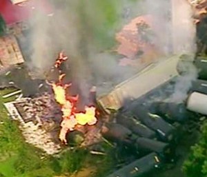 A fire burns after dozens of cars of a freight train carrying hazardous materials derailed in Hyndman, Pa. (WPXI via AP)