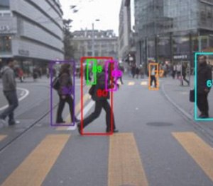 On the display, a colored box with that number stays drawn around the person as they move across the camera field.