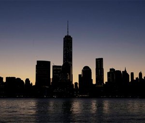One World Trade Center, center, dominates the lower Manhattan skyline. Thirteen years after the 9/11 terrorist attack, the resurrected World Trade Center is again opening for business, marking an emotional milestone for both New Yorkers and the United States as a whole.
