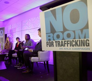 Miami Dolphins wide receiver Albert Wilson, second from right, speaks during a meeting between law enforcement officials and hotel groups to announce a campaign to prevent human trafficking surrounding next month's Super Bowl NFL football game in the Miami area, Thursday, Jan. 9, 2020, in Miami Beach, Fla.