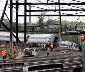 Federal investigators arrived Wednesday to determine why an Amtrak train jumped the tracks in Tuesday night's fatal accident.