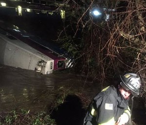 First responders work the scene after a car of a commuter train plunged into Alameda Creek after the train derailed Monday. (Aisha Knowles/Alameda County Fire Department via AP)