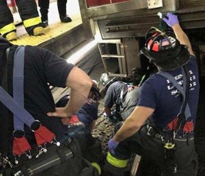 A woman trapped between an MBTA train and the platform at Central Square station in Cambridge was rescued. (Photo/Cambridge Fire Dept.)
