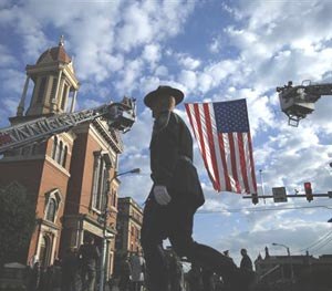 A law enforcement officer arrives for a funeral service for Pennsylvania State Trooper Cpl. Bryon Dickson, Thursday, Sept. 18, 2014, in Scranton, Pa.