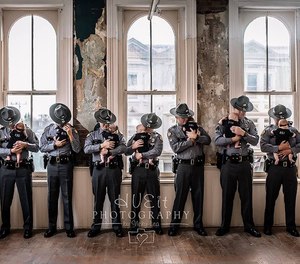 Each of the babies wore a specially-made onesie and their dads wore their Kentucky State Police uniforms. (Photo/Hueit Photography by Vicky Lea)