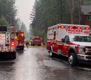 Crews work at the scene of a plane crash in Truckee, California.